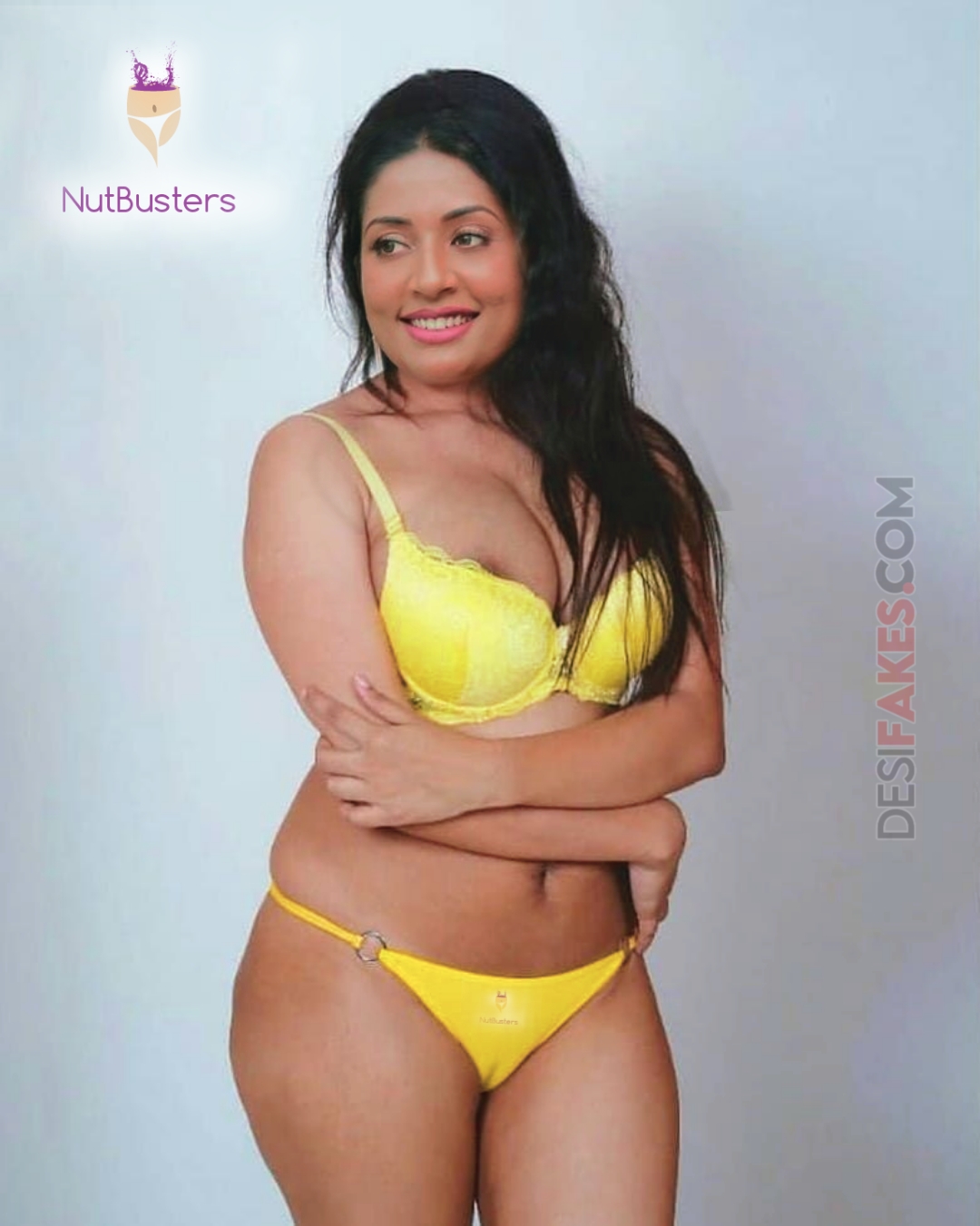 Navya Nair standing in yellow bikini